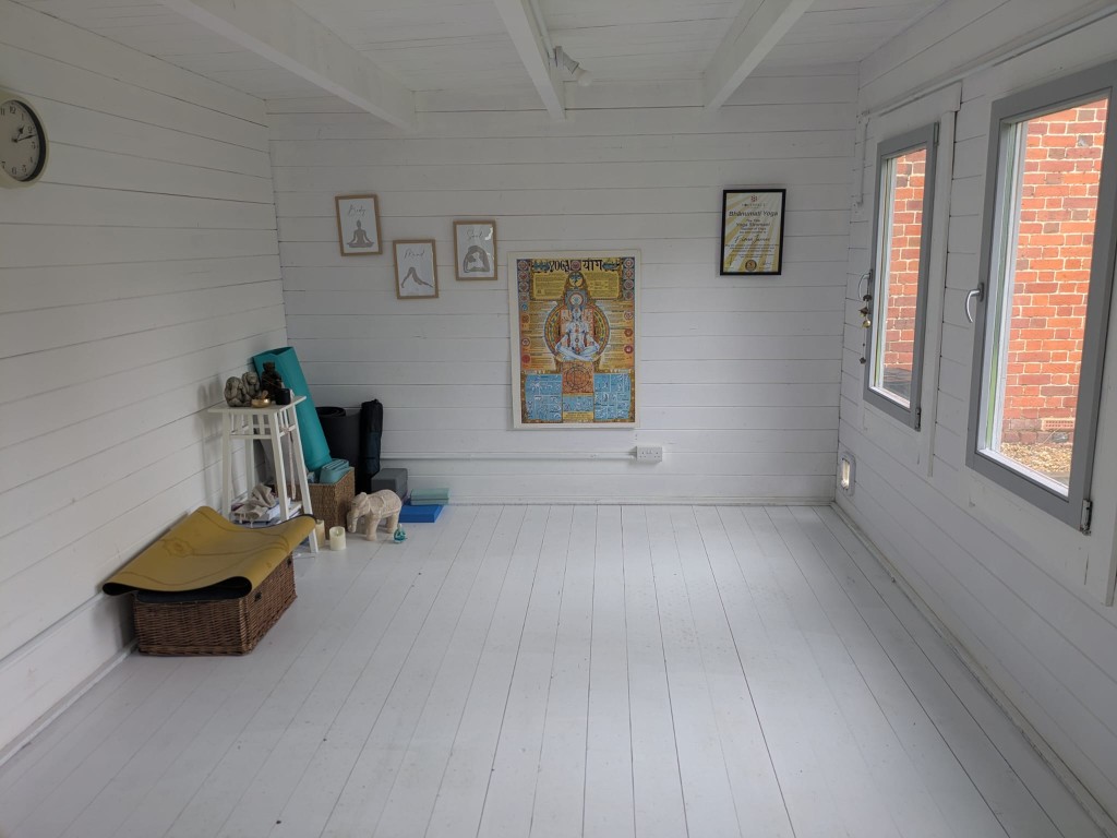 Bright white yoga studio with mats and soft natural light